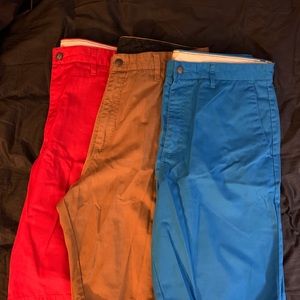 3 pairs of Volcom solid colored Shorts. Blue, Red & Brown. Size 36. 19x24” aprox